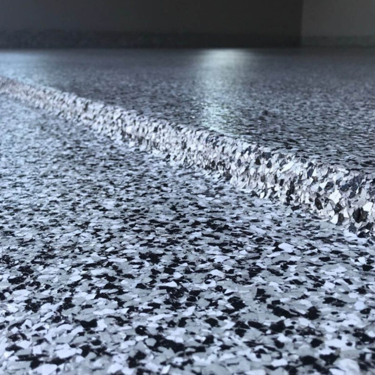 A close up of a finished garage floor project for Select Coatings